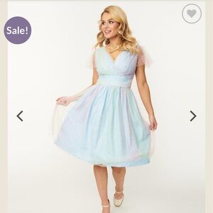 Size 4XL, Rainbow Tule material, lovely little white pearls. Sadly, has a tear